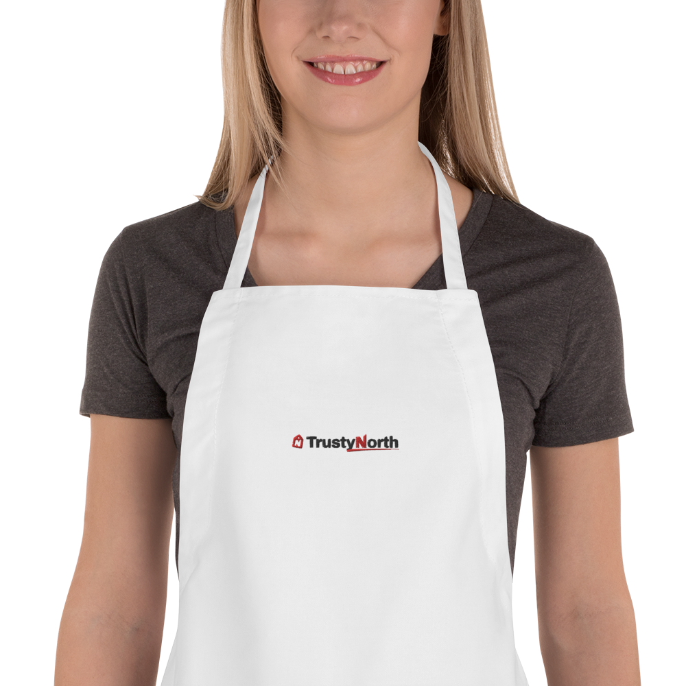 Holiday Baking Crew Apron in white with black and red embroidered TrustyNorth logo